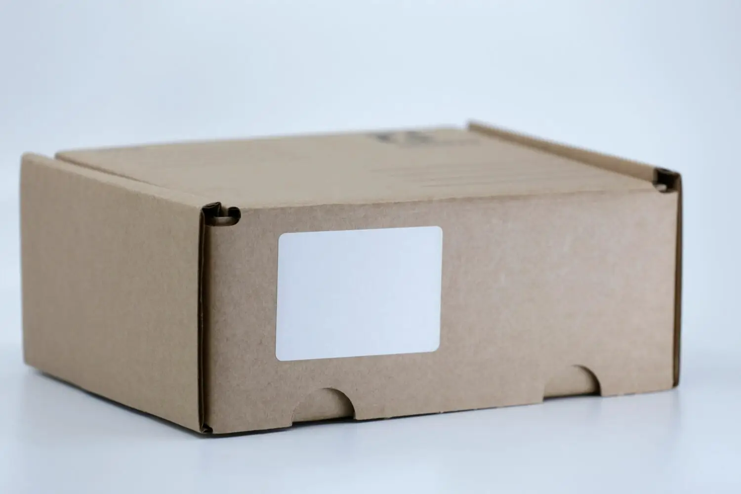 Image of ecommerce return box with altered shipping and how to prevent FTID fraud